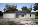 Charming one-story home with a two car garage, and light blue exterior paint at 13075 Se 35Th Ct, Belleview, FL 34420