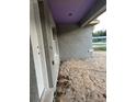 Close-up of stucco and wood trim details on the front exterior at 13075 Se 35Th Ct, Belleview, FL 34420