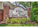 Landscaped brick sign welcomes you to Vistas at Lake Howell with vibrant greenery at 1541 Florentino Ln, Winter Park, FL 32792