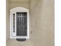 Inviting front door features sidelight window, modern door hardware, and a secure electronic keypad at 1541 Florentino Ln, Winter Park, FL 32792