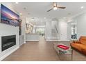 Open-concept living room with fireplace, built-ins, and wood-look tile flooring at 17726 Dangler Rd, Winter Garden, FL 34787