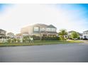 Beautiful two-story home with manicured lawn, privacy hedges, and inviting curb appeal at 2260 Rapollo Dr, Kissimmee, FL 34741