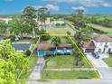 Aerial view of the property showcases the layout, lush landscaping, and neighborhood context at 2565 Brookshire Ave, Winter Park, FL 32792