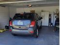 Spacious two-car garage featuring ample storage space and a parked SUV at 3020 Norlina St, Deltona, FL 32738