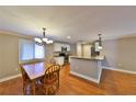 Dining area features a wooden table set with kitchen view and ample natural light at 426 S Lakemont Ave, Winter Park, FL 32792