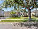 Well-maintained home with lush lawn, mature trees, and inviting curb appeal at 4918 Oakway Dr, St Cloud, FL 34771