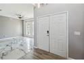 Grand foyer with marble floors, modern light fixtures, and a view into the adjacent living area at 6761 Scimitar Ave, Orlando, FL 32812