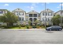Well-maintained condo complex with ample parking and landscaped grounds, offering a comfortable living environment at 8180 Boat Hook Loop # 105, Windermere, FL 34786
