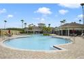 Resort-style pool with surrounding lounge area, perfect for relaxation and recreation under the sun at 8180 Boat Hook Loop # 105, Windermere, FL 34786