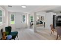 Bright living room with lots of windows and new flooring at 239 S Lake Cortez Dr, Apopka, FL 32703