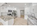 Modern kitchen with stainless steel appliances, granite countertops, and an open design at 2550 Barren Oak Ct, Deland, FL 32720