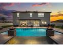 Backyard pool with tiled accents, lounge area and outdoor dining space, great for entertaining at 3209 Waterbridge Ct, Kissimmee, FL 34744