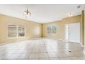 Spacious living room with tile flooring, neutral walls, and ample natural light at 112 Ivy Brook Ct, Davenport, FL 33897
