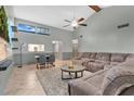Bright living room boasts high ceilings, a large sectional sofa, and an open layout perfect for entertaining at 218 Nettlewood Ln, Fern Park, FL 32730