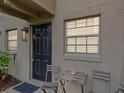 Inviting front entrance with a dark door and an outdoor seating area at 2507 E Central Blvd # 21, Orlando, FL 32803