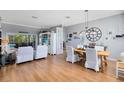 Inviting living room featuring elegant decor, wood floors, and lots of natural light at 3469 Foxton Ct, Oviedo, FL 32765