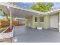 Attached carport providing covered parking and direct access to the home at 5201 Van Aken Dr, Orlando, FL 32808