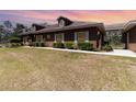 Attractive single-story home featuring manicured hedges and a connecting carport at 5242 Bancroft Blvd, Orlando, FL 32833