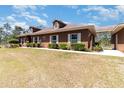 Attractive single-story home featuring manicured hedges and a connecting carport at 5242 Bancroft Blvd, Orlando, FL 32833
