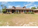 Charming single-story home with well-maintained landscaping and a spacious front lawn at 5242 Bancroft Blvd, Orlando, FL 32833