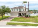 Lovely home featuring a brick driveway, two-car garage, and a beautifully landscaped front yard at 563 Copperdale Ave, Winter Garden, FL 34787