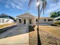 Inviting single-story home featuring a covered entrance, well-maintained yard, and an accessible driveway at 800 Marion Dr, Mount Dora, FL 32757