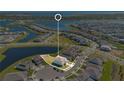 Beautiful aerial shot showcasing the property's location within a landscaped community near a picturesque lake at 13231 Panama Beach Ct, Orlando, FL 32827