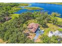Sprawling estate home with lush landscaping and direct lake access at 2910 Frontier Dr, Kissimmee, FL 34744
