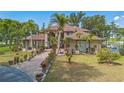 Stunning two-story home featuring meticulous landscaping and a circular driveway at 2910 Frontier Dr, Kissimmee, FL 34744