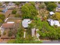 Aerial view of the property showing the landscaping, yard, and the surrounding neighborhood at 1010 N Clayton St, Mount Dora, FL 32757