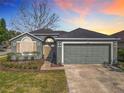 Charming home with well-maintained landscaping and a two-car garage at 135 Circle Hill Rd, Sanford, FL 32773