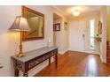 Inviting entryway showcasing hardwood floors, a stylish console table, and neutral paint at 487 Oak Haven Dr # 487, Altamonte Springs, FL 32701