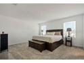 Neutral main bedroom features carpet, great natural light, and spacious layout at 830 Turner Ln, Winter Haven, FL 33881