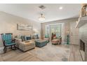 Bright living room featuring elegant decor, a large window, and comfortable seating at 1013 Love Ln # 32, Apopka, FL 32703