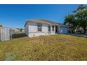 Well-kept one-story home with green lawn space and a two-car garage at 104 Birmingham Dr, Kissimmee, FL 34758