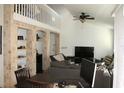 Bright living room with a high ceiling, tile flooring, and modern furnishings at 1321 Arbor Vista Loop # 325, Lake Mary, FL 32746