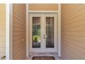 Elegant entryway with beautiful decorative glass double doors and tiled floor creating a grand and inviting entrance to the home at 1819 Sw 29Th St, Ocala, FL 34471