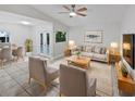 Bright living room features neutral tones, a ceiling fan, and stylish furniture perfect for modern living at 341 Kirkcaldy Dr, Winter Springs, FL 32708