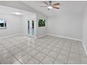 Spacious living room featuring ceramic floors, large windows and neutral paint at 341 Kirkcaldy Dr, Winter Springs, FL 32708