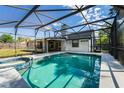 Screened-in pool with a connecting jacuzzi, perfect for outdoor relaxation and entertainment at 515 Columbus Ave, Orange City, FL 32763