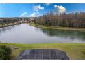 Stunning aerial lake view from backyard offering a scenic vista of trees and clear sky at 5502 Willow Bend Trl, Kissimmee, FL 34758