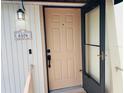 Inviting front door entry with security features and a decorative address plaque at 6104 Topher Trl # 6104, Mulberry, FL 33860