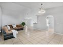 Spacious living room featuring tile flooring, neutral walls, and an open layout at 6749 Westlake Blvd, Orlando, FL 32810