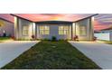 Charming single-Gathering home with a contemporary design, illuminated by warm sunset hues at 804 Colville Dr, Kissimmee, FL 34759