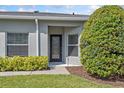 Inviting front entrance with decorative glass door and manicured landscaping at 819 Featherstone Ln, Lake Mary, FL 32746