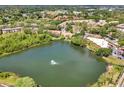 Aerial view of the Key West Condominiums with lake and mature trees at 980 Mooring Ave # 105, Altamonte Springs, FL 32714