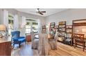 Bright dining room with natural light, wood floors, a ceiling fan, and open shelving at 980 Mooring Ave # 105, Altamonte Springs, FL 32714