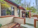 Close up view of the home's entry and hardscape showing windows, doors, and architecture at 410 Sandspur N Rd, Maitland, FL 32751