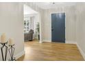 Bright foyer featuring lovely wood floors, fresh paint, and a welcoming atmosphere for visitors and residents at 1011 Terry Dr, Altamonte Springs, FL 32714