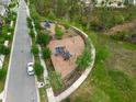 A vibrant community playground featuring modern equipment and a safe, fenced-in area at 10151 Salt Point Dr, Winter Garden, FL 34787
